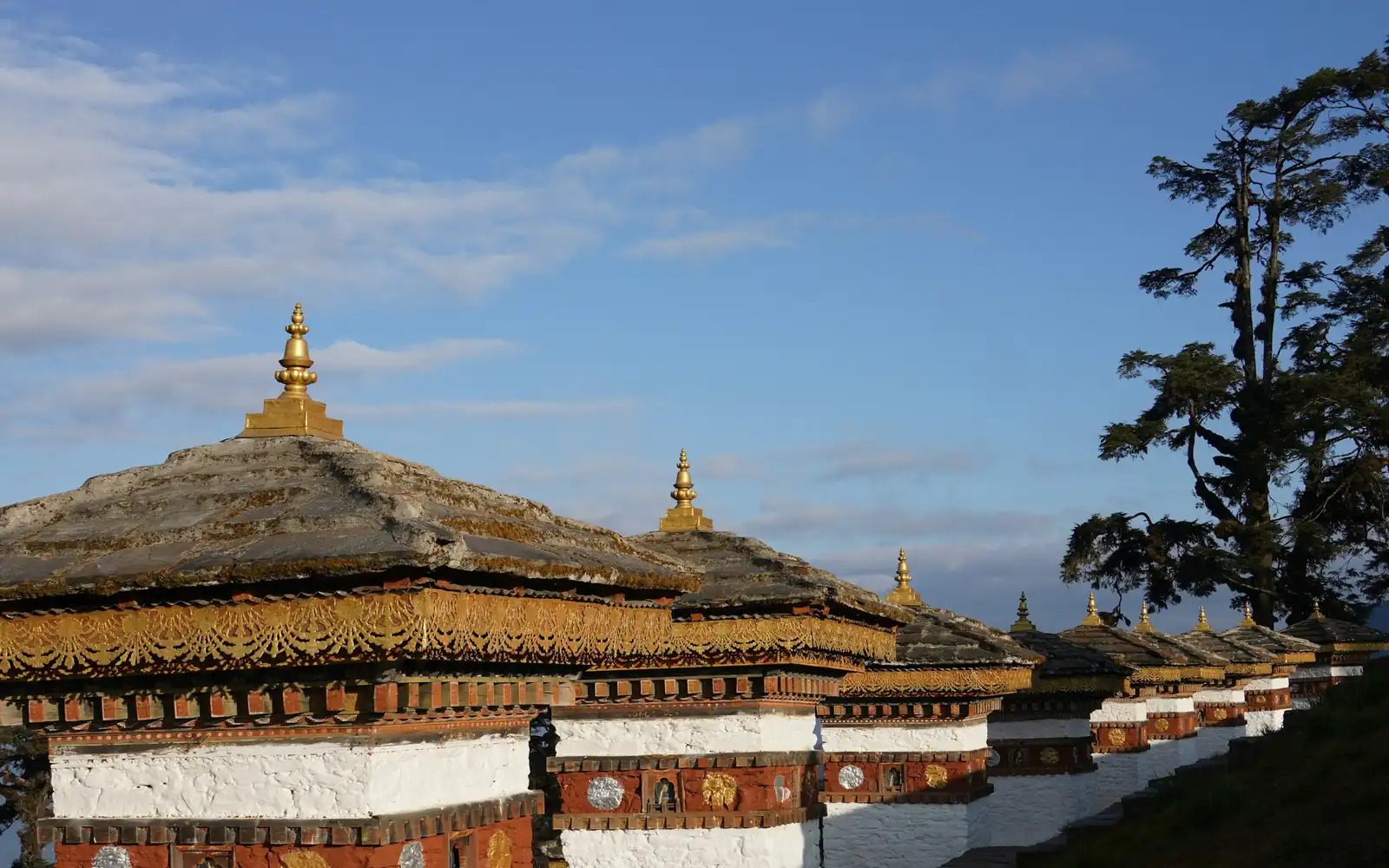 A golden temple roof against the sky