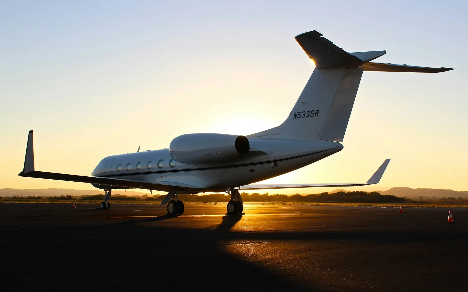 A private jet at golden hour, ready to depart